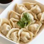 Homemade Asian Chicken Dumplings with Soy Dipping Sauce photo