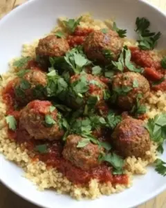Homemade Moroccan meatballs with herb couscous photo