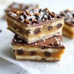 Homemade Salted Pretzel Chocolate Chip Cookie Dough Snickers Bars photo