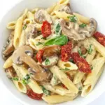 Homemade Vegan Creamy Mushroom Pasta with Sun-Dried Tomato photo